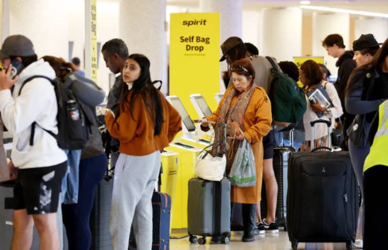 Spirit Airlines will settle a class action lawsuit over 'gotcha' carry-on luggage fines by paying up to $8.25 million