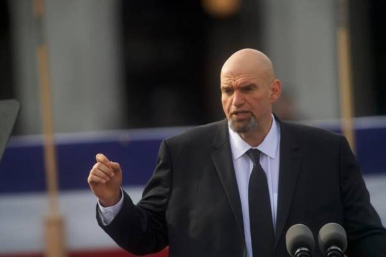 Sen. John Fetterman claims that if the House GOP avoids a shutdown, he will "save democracy" by donning a suit