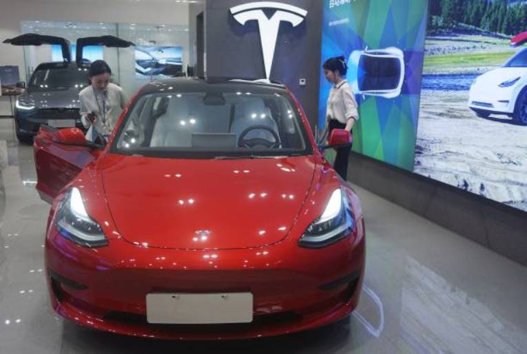 In China, Tesla released an updated Model 3 with an increased range